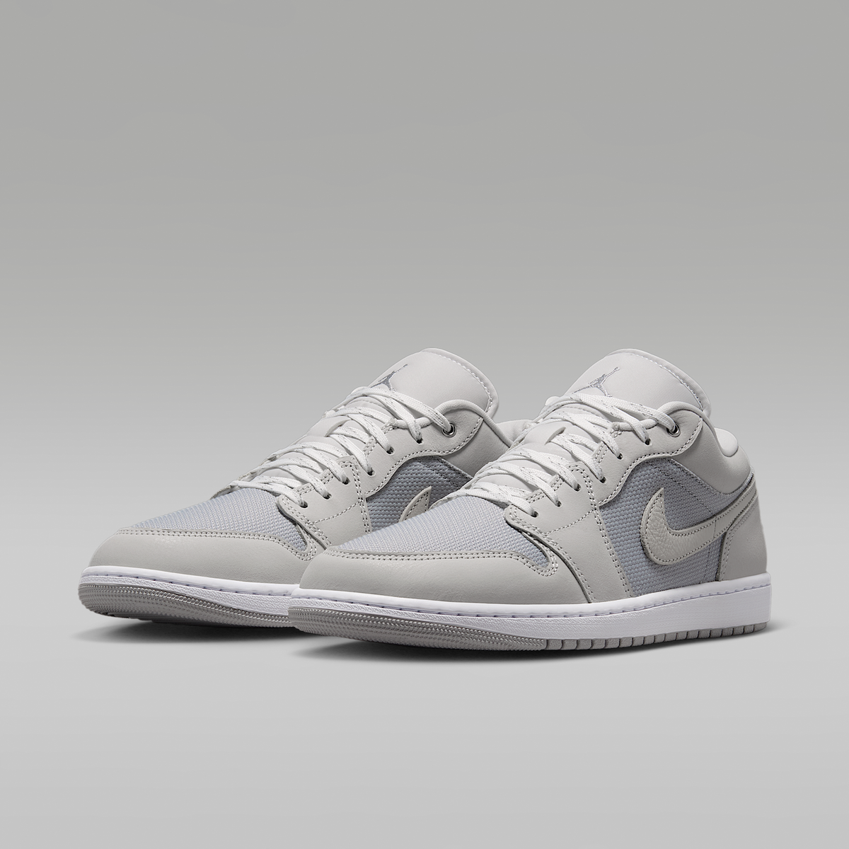 Air Jordan 1 Low SE Off White Soft Pearl Light Smoke Grey Men's - angled view of the pair