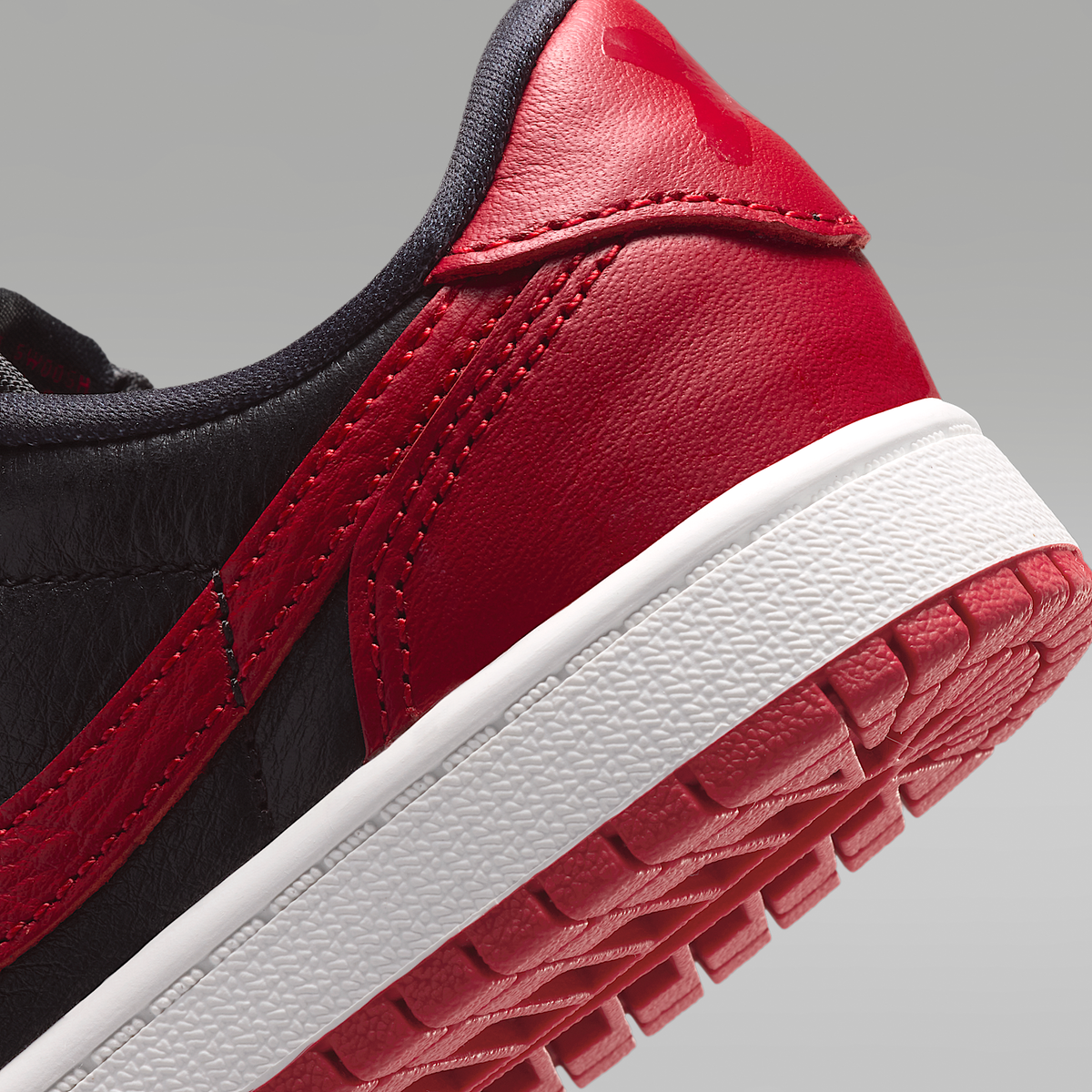 Jordan 1 Retro Low OG "Banned" Black Varsity Red Summit White Black Little Kids' - heel and outsole detail